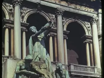 Fountain of the Great Lakes with bronze draped figures surrounding a cascading water vessel.
