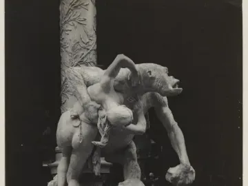Emmanuel Frémiet\'s Gorilla Carries a Woman sculpture shows an ape-like figure carrying a nude woman over its shoulder.