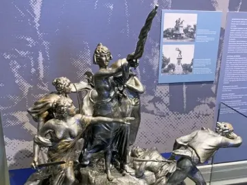 The National Monument of Costa Rica shows a dramatic bronze battle scene with a central female figure raising a broken spear above fallen figures.