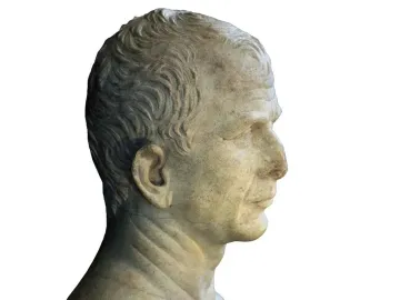 Marble bust of an older man in right profile with short wavy hair and a rough unfinished base.