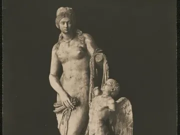 Venus Felix sculpture with a standing draped woman holding a flower beside a winged child.