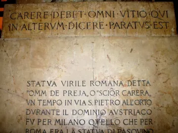 Stone slabs beneath the Scior Carera with Latin and Italian engraved inscriptions.