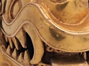 Serpent Labret with Articulated Tongue showing a metallic serpent head with almond-shaped eyes, open mouth, and detailed ridges.
