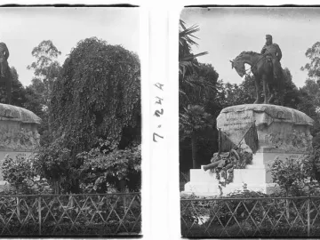 Monument to General Martínez-Campos with an equestrian statue, relief carvings, and a small cannon in a park setting.