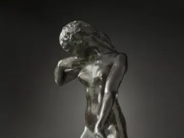 Standing Fauness, a dark bronze female figure with her head bowed and a draped garment at her side.