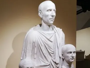 Togatus Barberini, a white marble statue of a man in a toga holding two portrait busts.
