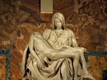 Michelangelo’s Pietà, a white marble sculpture of the Virgin Mary holding the body of Christ.