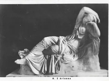 Sleeping Ariadne, a reclining white marble female sculpture with crossed legs and one arm raised over her face.