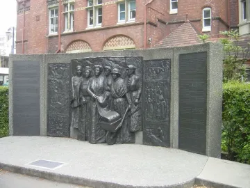 Kate Sheppard National Memorial bronze relief with plaques beside a brick building