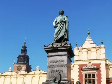 Adam Mickiewicz Monument with bronze figures and an eagle in Kraków’s main square