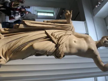 Townley Venus, a white marble statue of a partially draped female figure in a museum gallery.