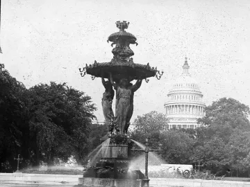 Bartholdi Fountain with robed female statues and the U.S. Capitol dome in the background.