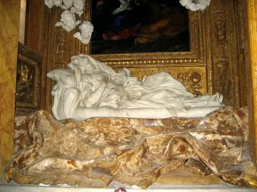 Ecstasy of Blessed Ludovica Albertoni in white marble, reclining in flowing robes within an ornate gilded niche