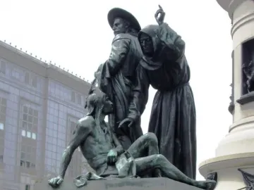 Pioneer Monument bronze sculptural group showing three figures above the carved words \