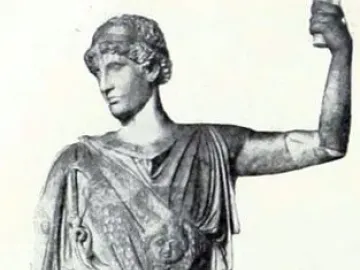 Athena Lemnia statue of a draped female figure with her head turned left and one arm raised holding a cylindrical object.