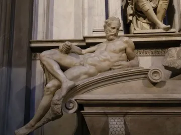Reclining marble statue of Lorenzo II de Medici by Michelangelo, shown with a downward gaze and bent arm.