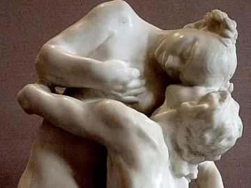 Sakuntala, a white marble sculpture of two nude figures embracing closely with their heads pressed together.