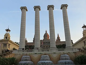 The Four Columns standing before a domed building and fountain