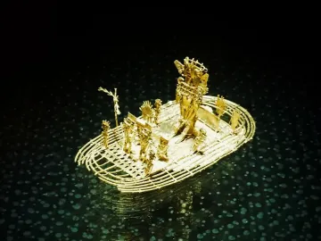 The Muisca Raft, a golden raft sculpture with a central figure wearing an elaborate headdress and several smaller figures around it.