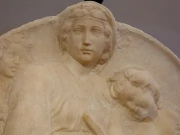 Close-up of Michelangelo’s Pitti Tondo showing a relief of a woman and two children.