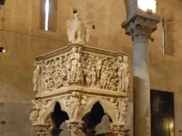Sant\' Andrea Pulpit with carved figures and stone columns inside a church interior