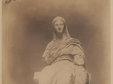 Demeter of Knidos, a seated veiled woman statue with missing forearms.