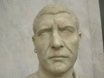 White marble bust of Philip the Arab with short textured hair and a serious expression.