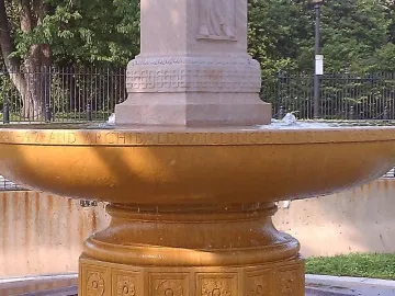 Butt-Millet Memorial Fountain inscription on a stone basin with gently bubbling water