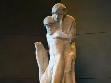 The Rondanini Pietà, a tall unfinished marble sculpture of two intertwined figures on a stone pedestal.