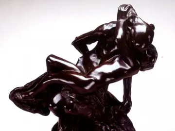 Triumphant Youth bronze sculpture showing two muscular male figures intertwined, one draped across the other\'s back and shoulders.