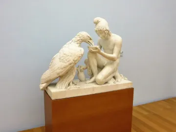 Ganymede with Jupiter\'s eagle marble sculpture of an eagle drinking from a bowl held by a kneeling male figure