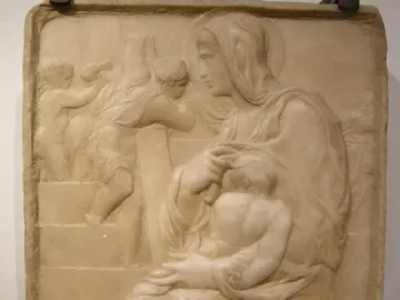 Madonna of the Stair relief showing a seated woman holding a child on her lap beside climbing figures in the background.