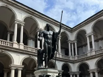 Napoleon as Mars the Peacemaker, a bronze nude statue on a hexagonal pedestal in the Brera courtyard.
