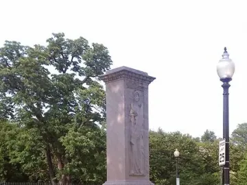 Butt-Millet Memorial Fountain with a light-colored central pillar, relief figure, and broad stone basin.