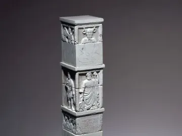 The Nautae Parisiaci Pillar, a tall stone monument with stacked carved blocks and relief figures.