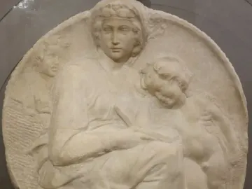 Pitti Tondo marble relief showing a seated woman with two children.