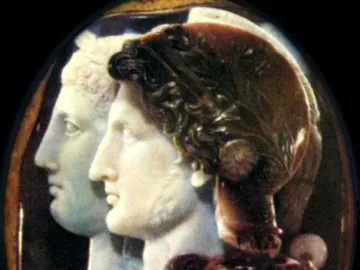 Gonzaga Cameo showing two carved profiles facing right on a dark background.