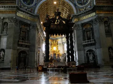 St. Peter\'s Baldachin beneath the ornate dome of St. Peter\'s Basilica