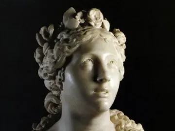 Blessed Soul marble bust of a woman with an upward gaze and curled hair