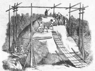 Historical engraving of men cutting a large granite bowl-shaped stone with hand tools and wooden scaffolding.