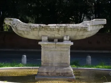 Fontana della Navicella stone boat sculpture on a pedestal in a fountain basin