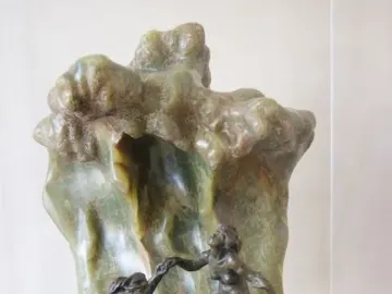 The Wave by Camille Claudel, with three nude bathers integrated into a cresting stone wave.