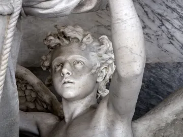 Marble sculpture of Angelo Nocchiero showing a youthful, curly-haired figure with an upward gaze, one raised arm, a wing, and a braided rope beside him.