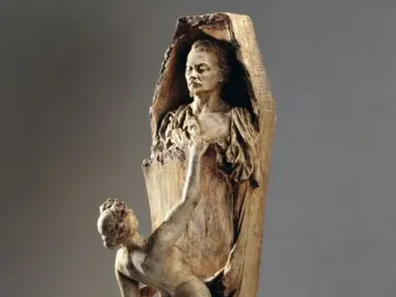 La Gloire showing a woman emerging from a broken coffin-like form as a nude figure reaches upward beside it.