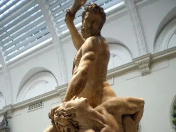 Samson Slaying a Philistine sculpture showing two muscular male figures in a dramatic struggle, with one standing over the other and raising an object to strike.