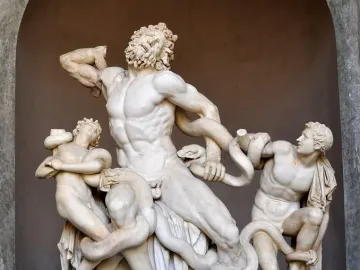 Laocoön and His Sons, a white marble sculpture of three figures struggling against coiling snakes.