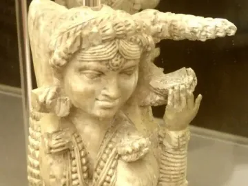 Close-up of the Pompeii Lakshmi, a carved ivory female figure with necklaces, bangles, and an elaborate hairstyle.