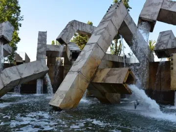 Vaillancourt Fountain with large concrete blocks and tubes sending water into a turbulent pool.