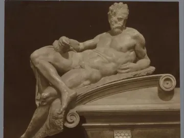 Michelangelo’s Evening, a reclining marble figure resting on one arm and holding drapery.