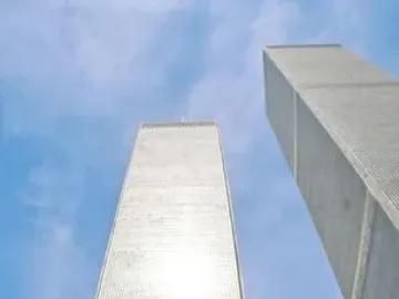 Cloud Fortress in the foreground with the Twin Towers rising behind it against a blue sky.